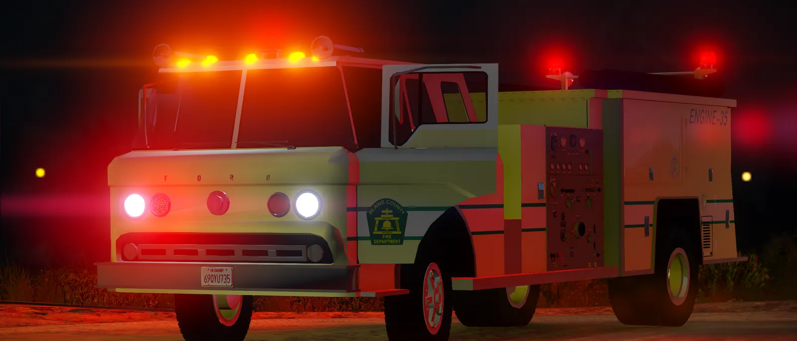 A fire engine with its lights on at night